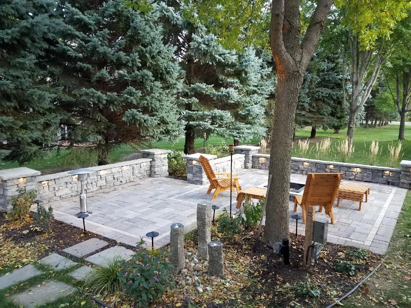 Completed French drain installation with gravel and restored lawn